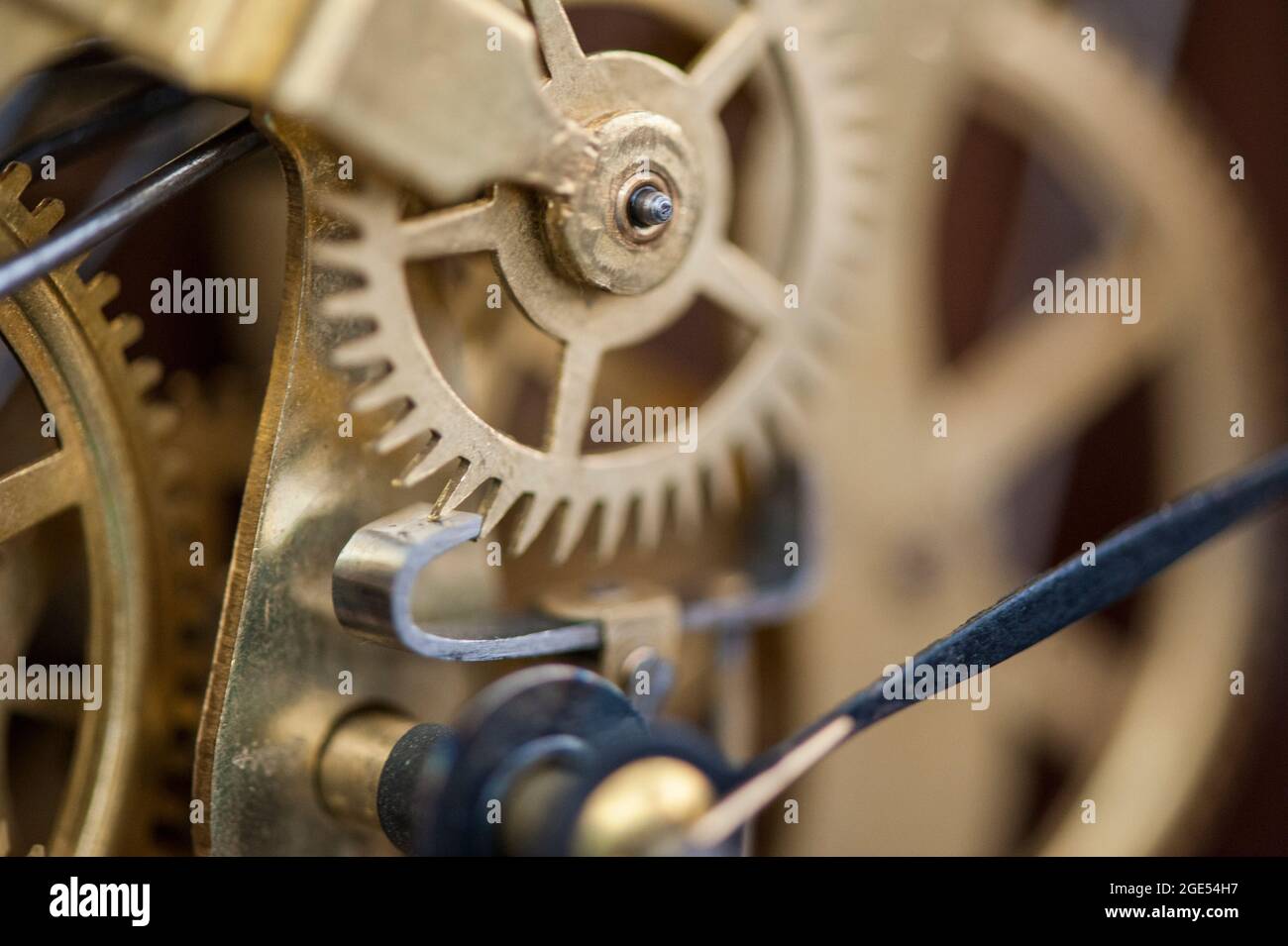 The internal movements of an analog clock. Stock Photo