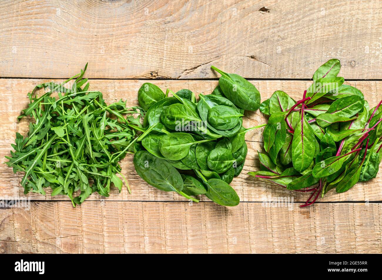 Mix Salad leafs, Arugula, Spinach and swiis Chard. Wooden background. Top  view Stock Photo - Alamy