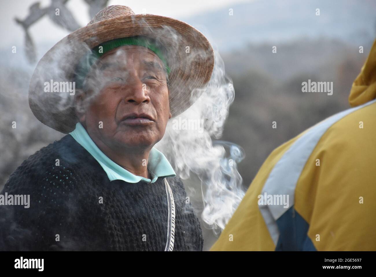 Indigenous people purify themselves with incense at the start of a ritual to mark the winter solstice. Stock Photo
