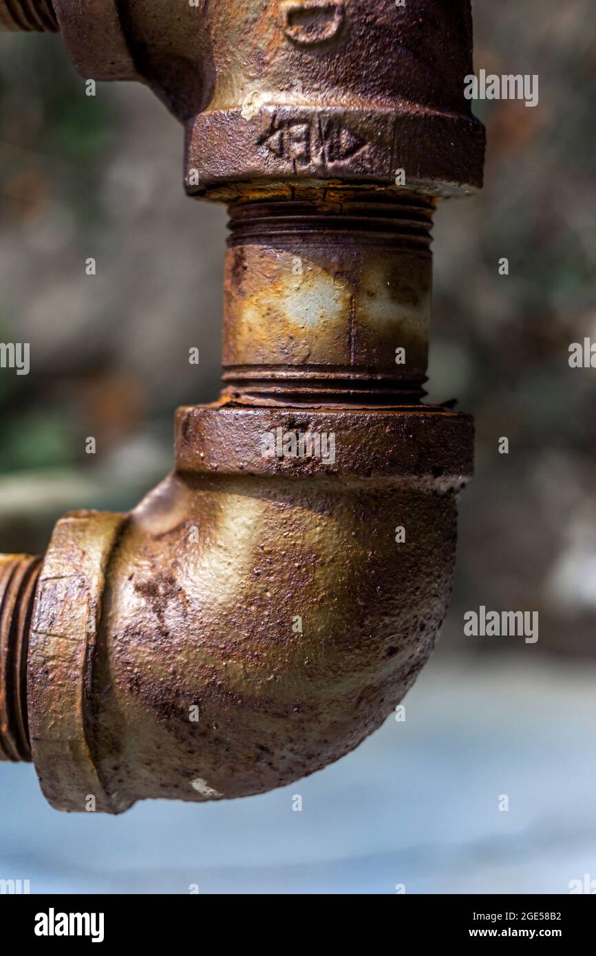 Close view of rusty metal piping elbow connector Stock Photo - Alamy