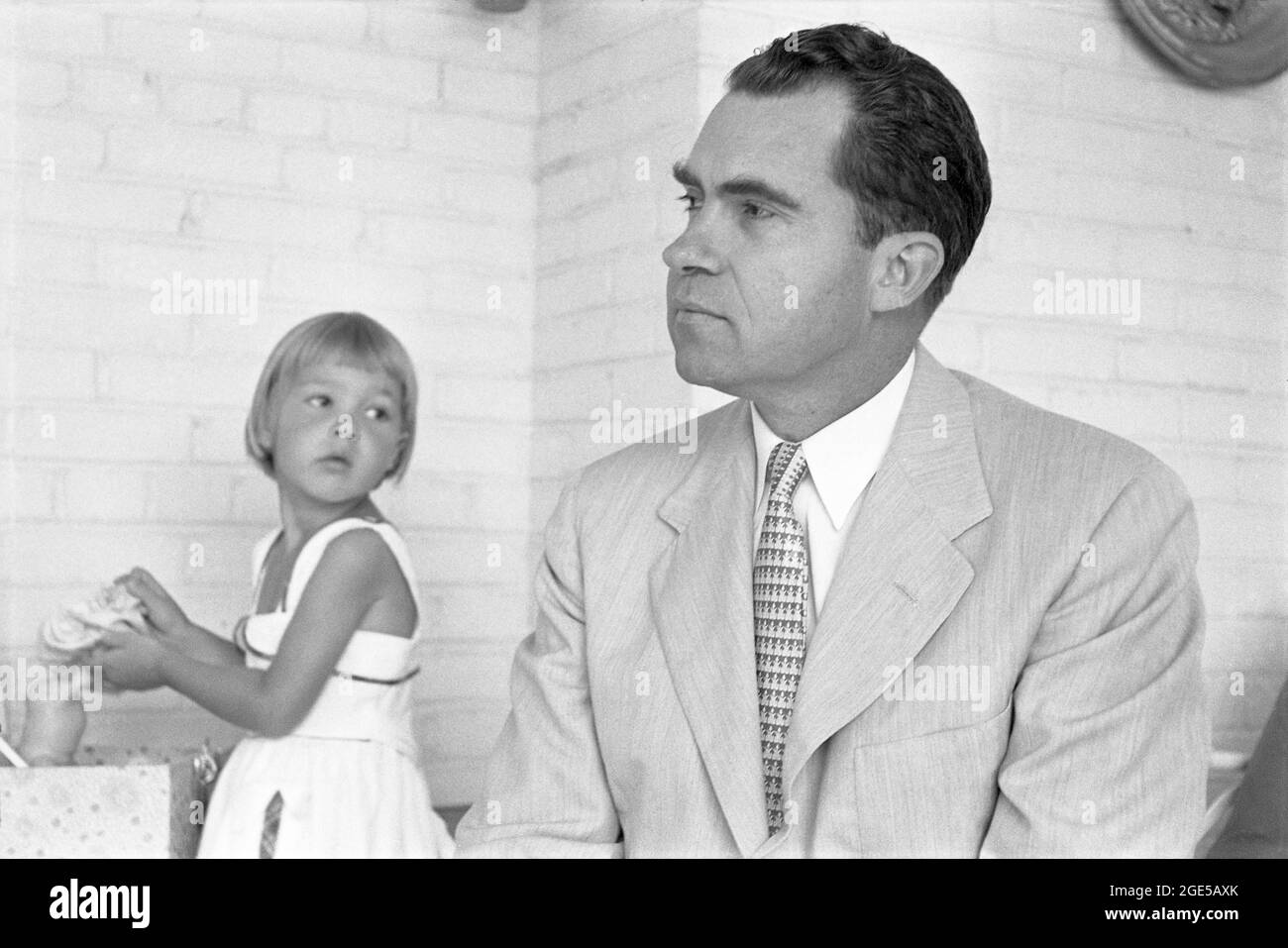 California Senator Richard Milhous Nixon, who would later become the 36th U.S. Vice President (under Eisenhower) and the 37th U.S. President,  with his daughter in July, 1952. (USA) Stock Photo