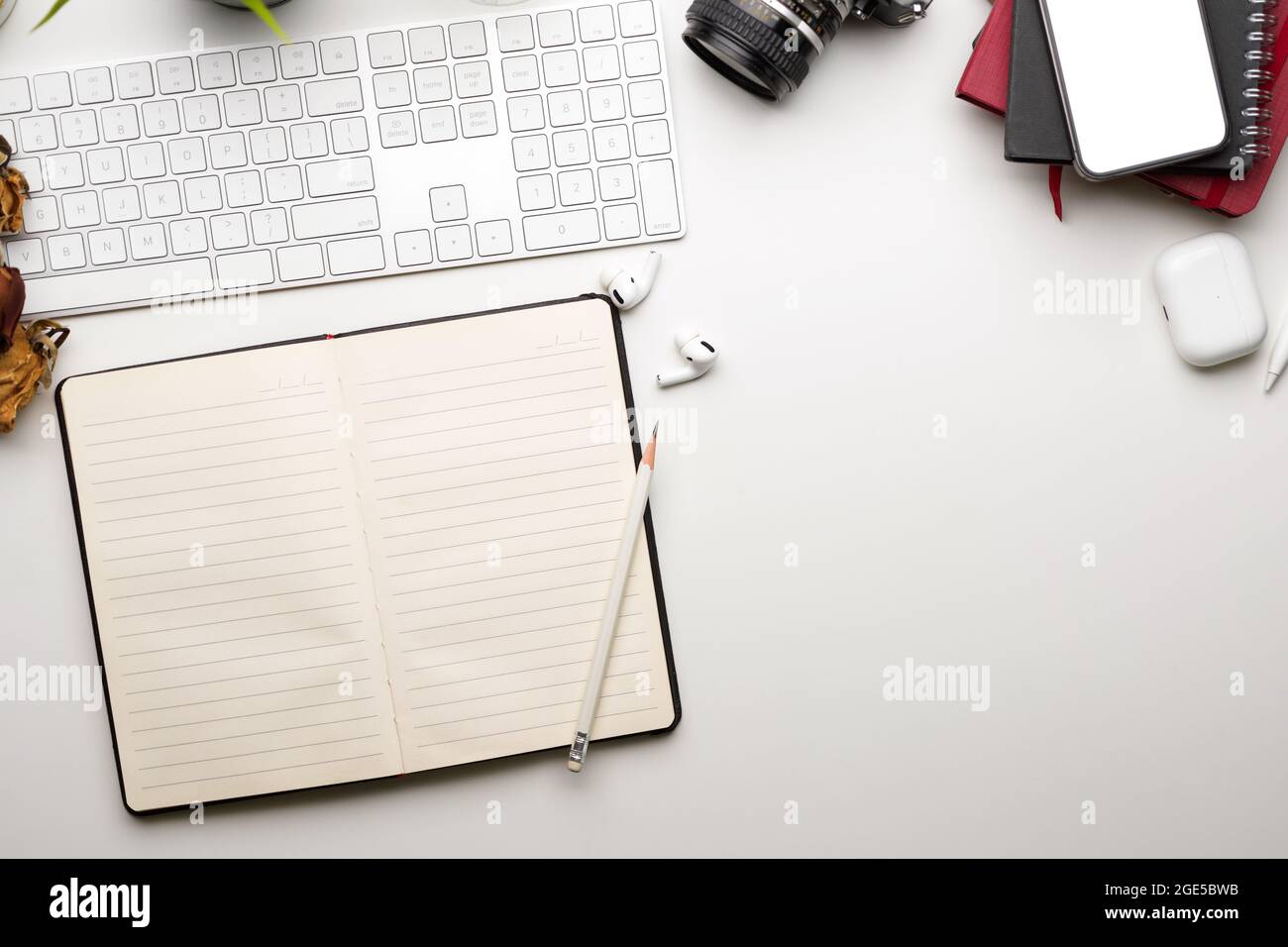 Flat lay, Minimal workspace with opened blank notebook, copy space on