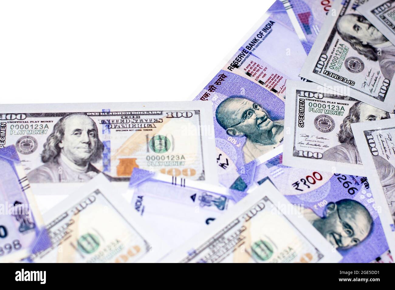 Close-up Exchange US dollar and Indian rupees on isolated white background. US and Indian paper currency. Stock Photo