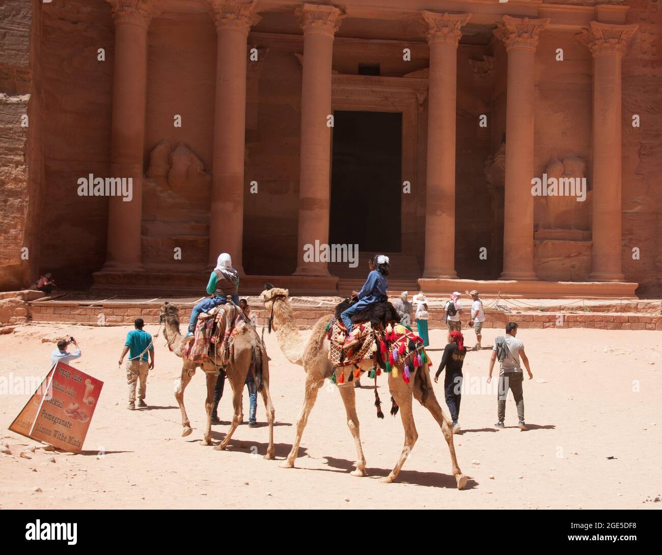 Tourists and Camels in front of the Treasury, Petra, Jordan, Middle East Stock Photo