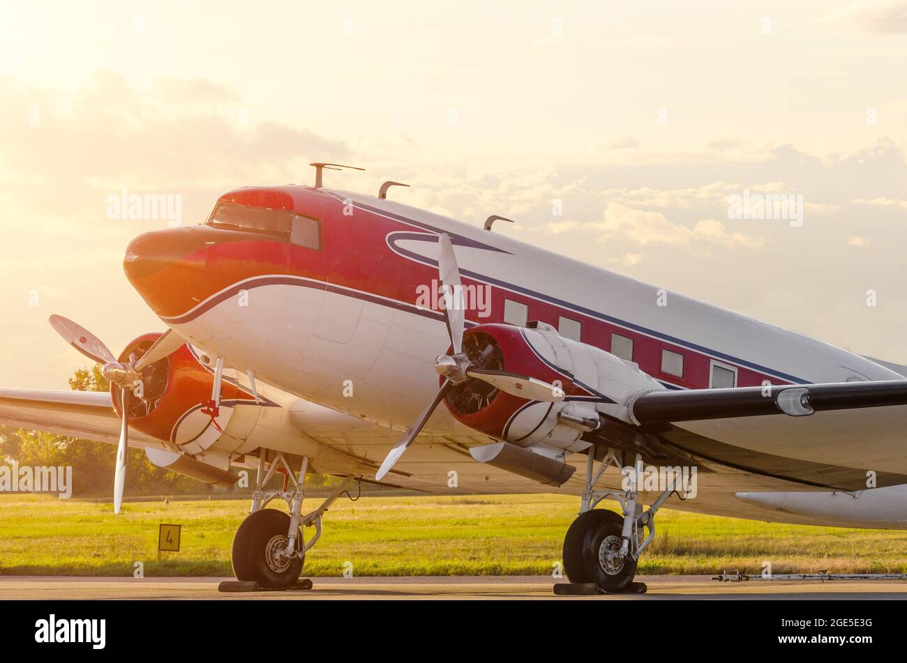 Vintage turboprop airplane at the airport at sunset Stock Photo - Alamy