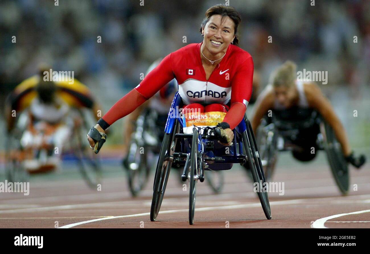 File photo dated 27-09-2004 of Canada's Chantal Petitclerc celebrates winning gold in the Women's T54 200 metres final at the Paralympic Games in Athens, Greece. Issue date: Tuesday August 17, 2021. Stock Photo