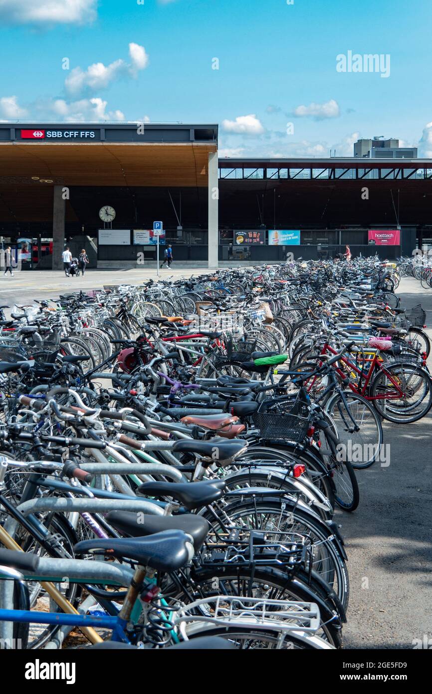Zurich, Switzerland - July 13th 2019: Masses of parked bicycles in front of the main railway station Stock Photo