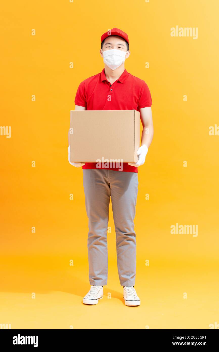 Healthy guy wear medical mask bringing parcel shop store order stop