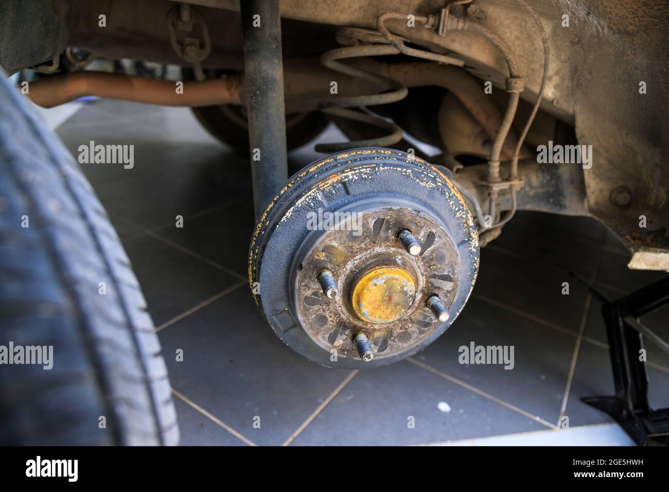A rear hub of the car after removing a tire and wheel, maintaining a ...