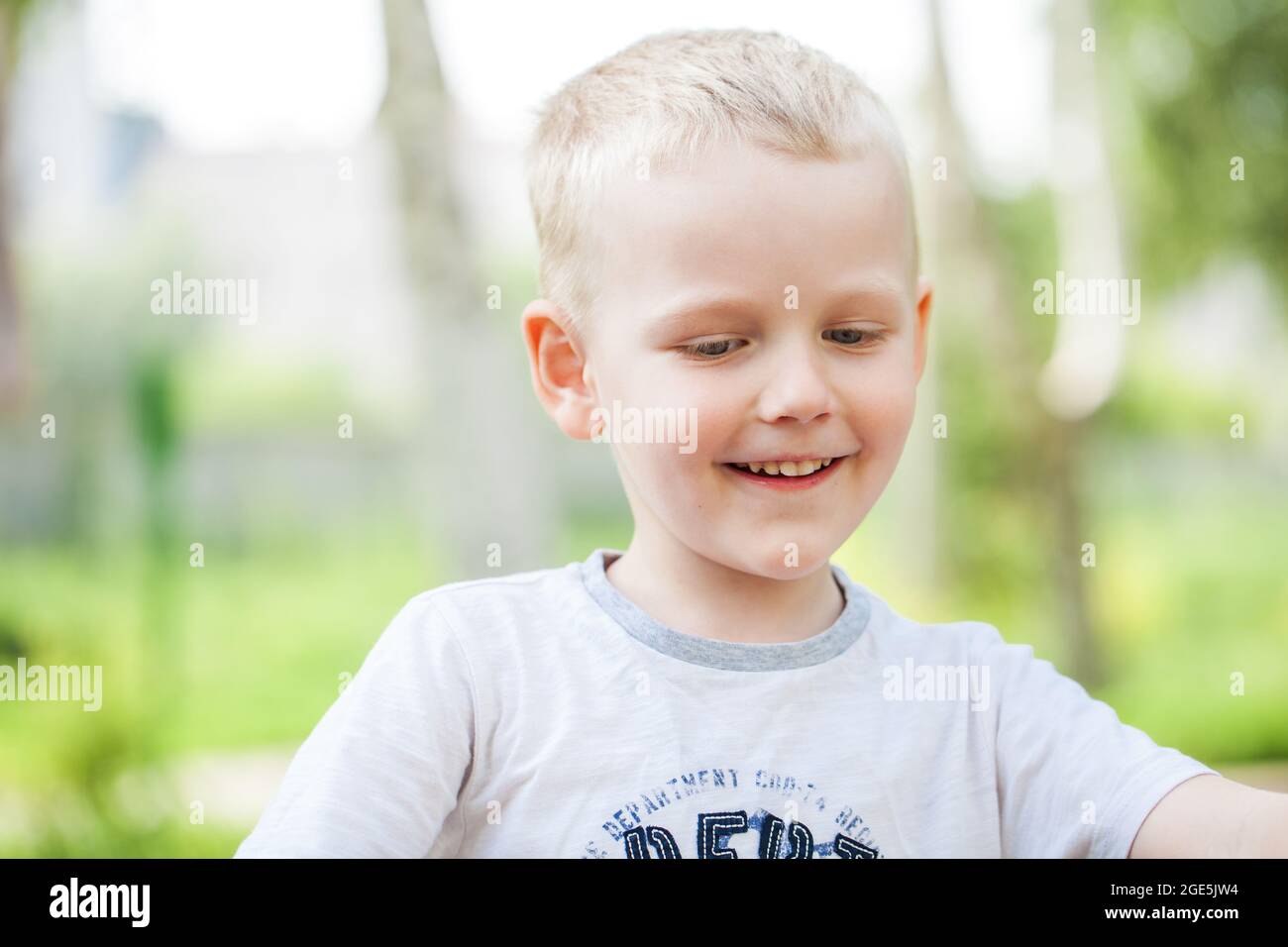 Close-up portrait of a little boy in a summer park Stock Photo - Alamy