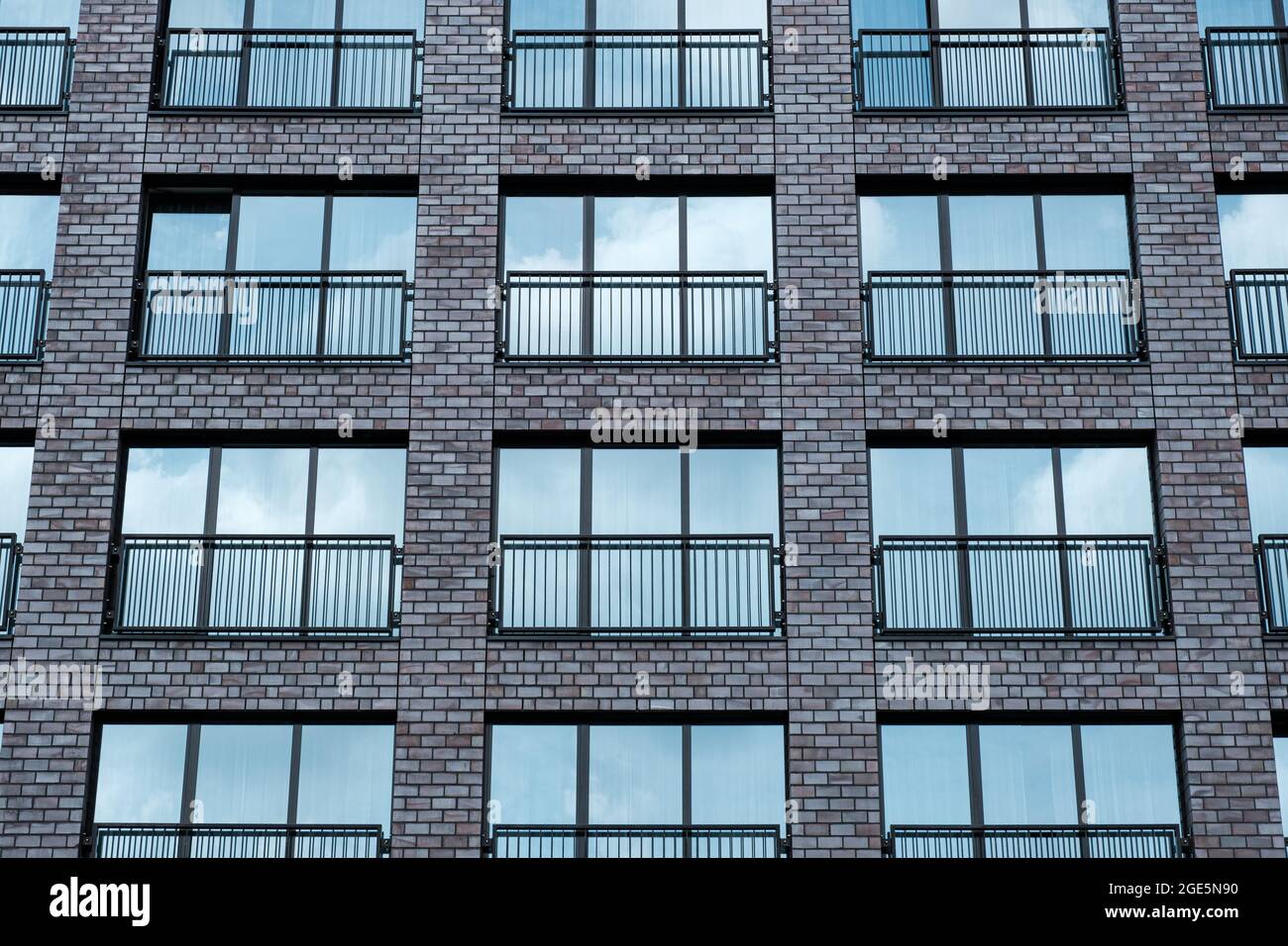 Modern office brick building window facade with sky reflection Stock ...
