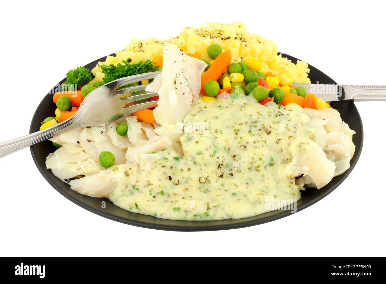 Cod with parsley sauce and mashed potato meal isolated on a white