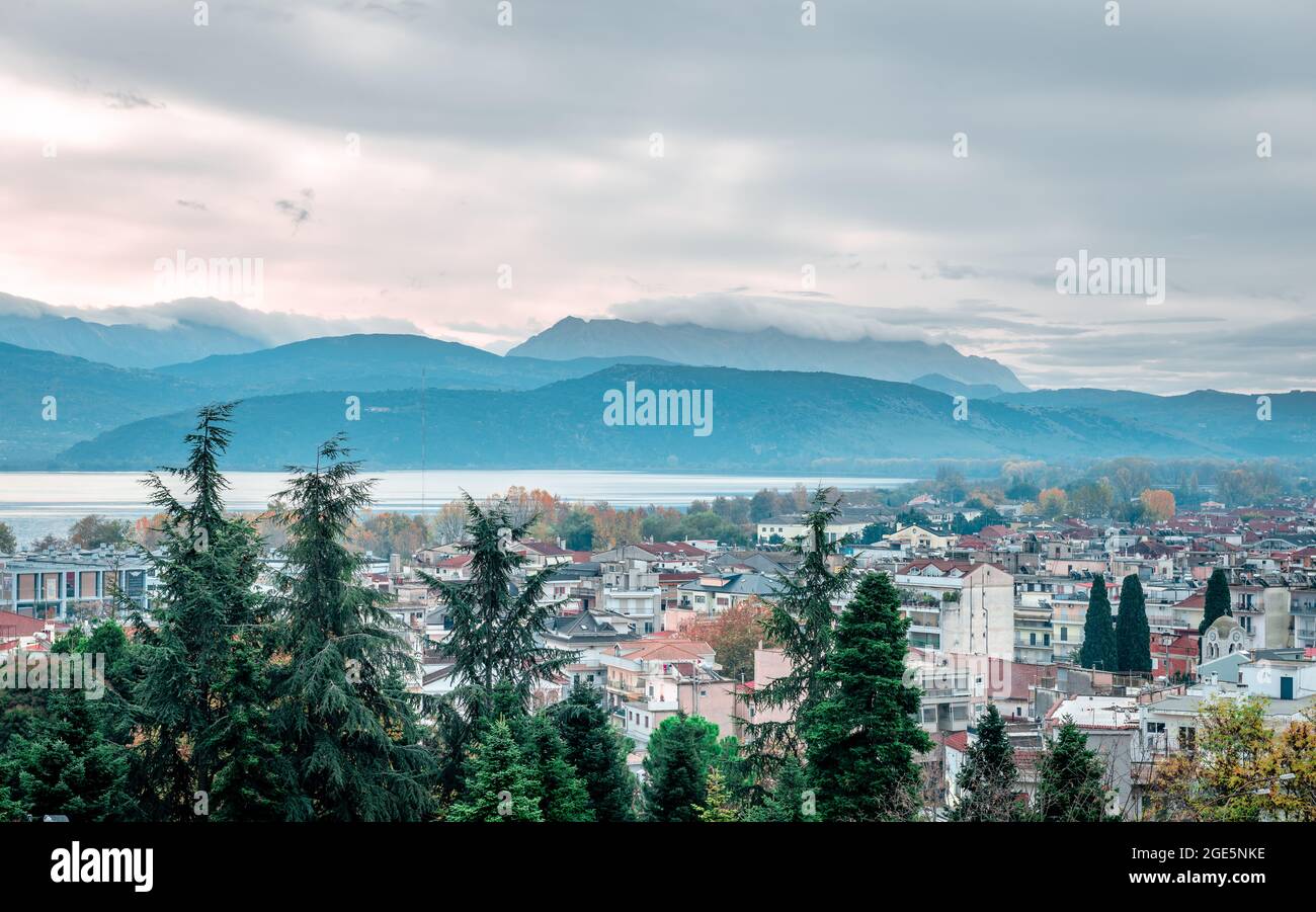 The skyline of Ioannina city in Epirus, Greece, with the lake Pamvotis and Mitsikeli Mount in the background. Stock Photo