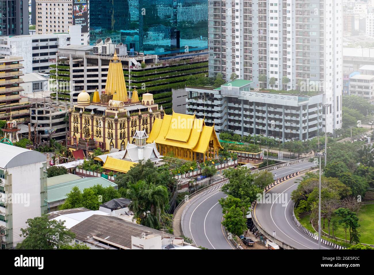 BANGKOK, THAILAND - AUG 15 :Aerial view of the Golden Buddha temple in Wat Phasi Temple in Ekamai road. Urban town, Thailand. Stock Photo