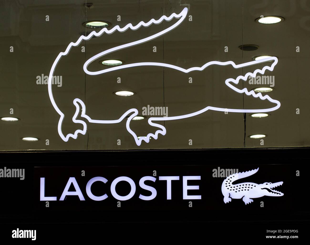 Closeup of Lacoste sign on store front, Lacoste Stock Photo - Alamy