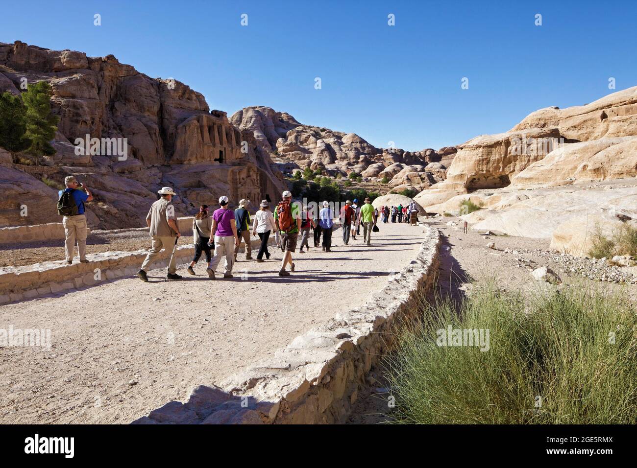 Tourists on their way to the Siq, Gorge, Petra, UNESCO World Heritage Site, Kingdom of Jordan Stock Photo