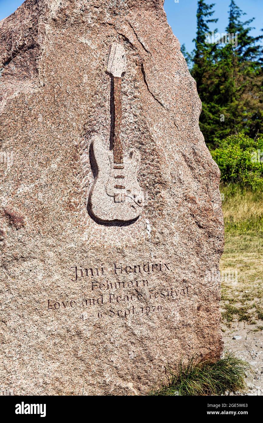 Memorial stone with inscription and relief of an electric guitar by Jimi Hendrix, Love and Peace