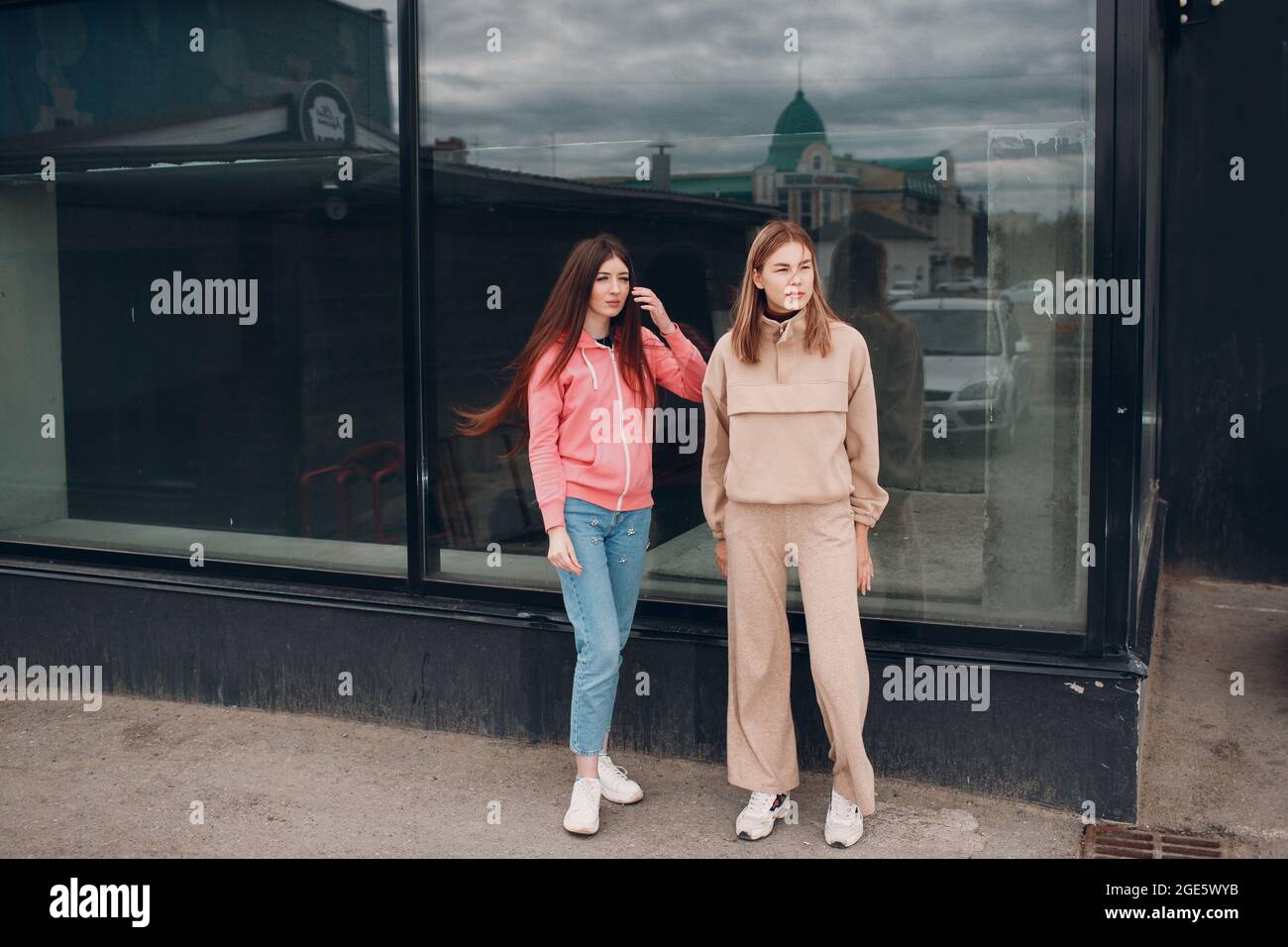 Two girls outside walking hi-res stock photography and images - Alamy