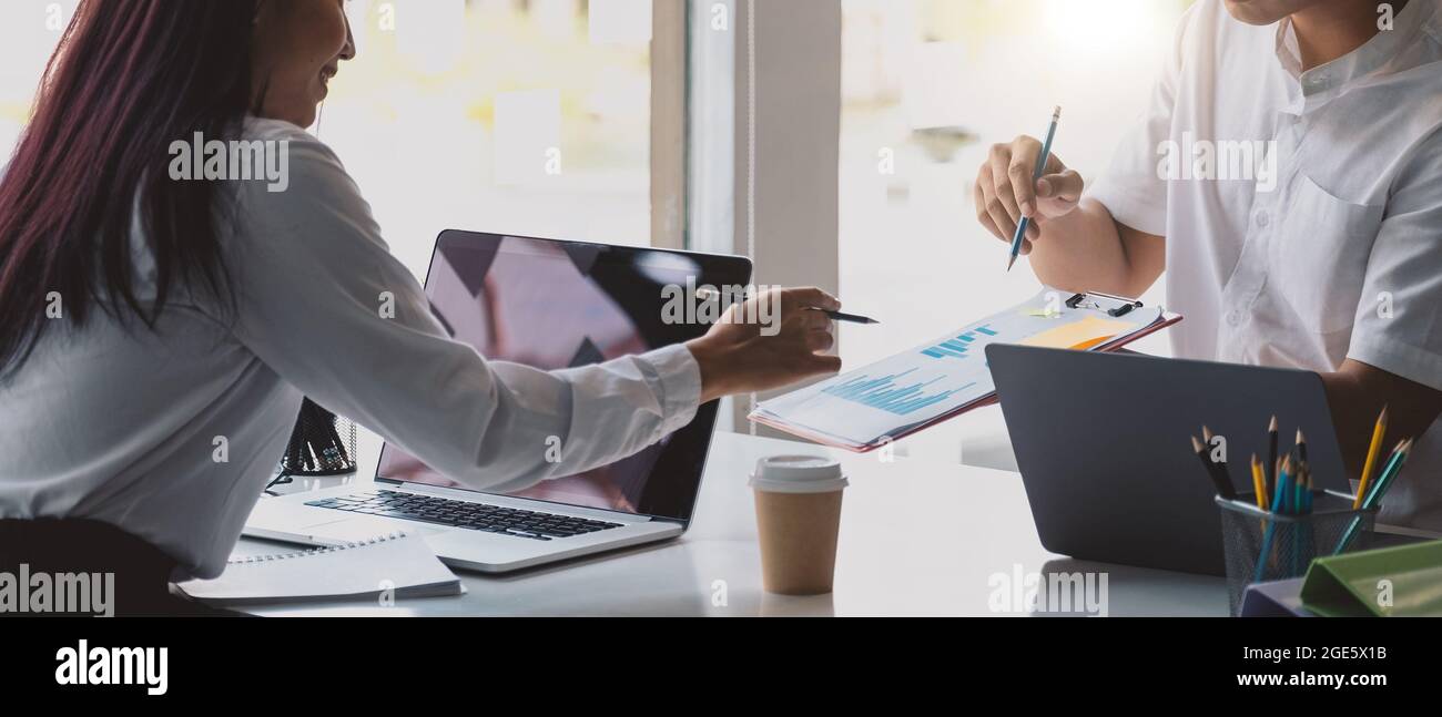 Close up of diverse businesspeople group discussing charts and graphs on meeting, multiethnic team of corporate managers or employees analyzing Stock Photo