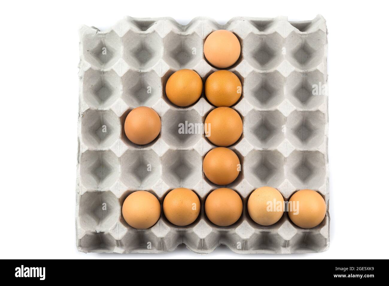 Eggs arranged in a number isolated on white background Stock Photo