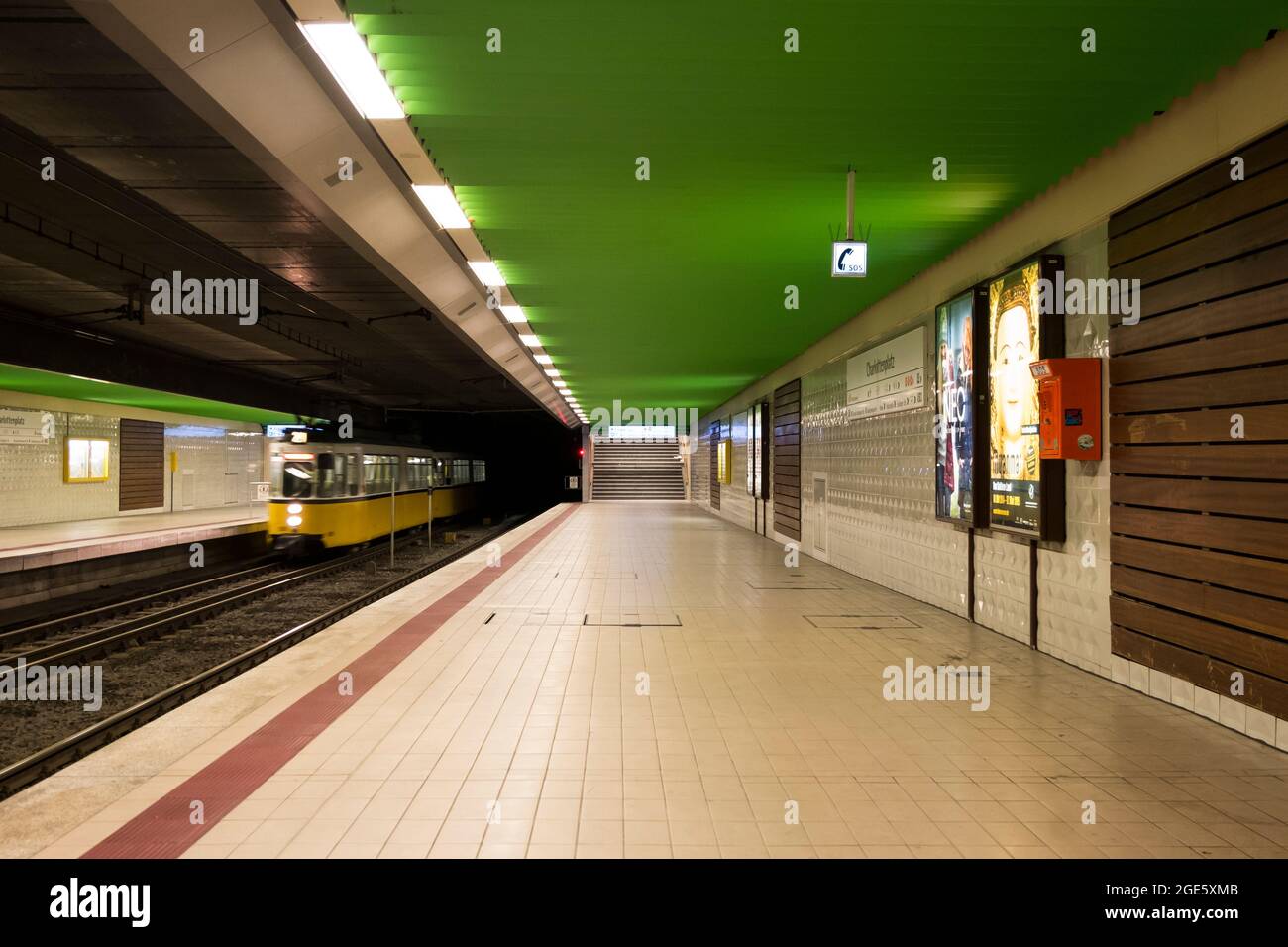 Inside the Charlottenplatz Stadtbahn station, with bright green ceiling