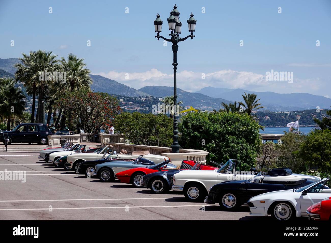 Vintage car parked in front of the seaside Opera de MonteCarlo, Casino