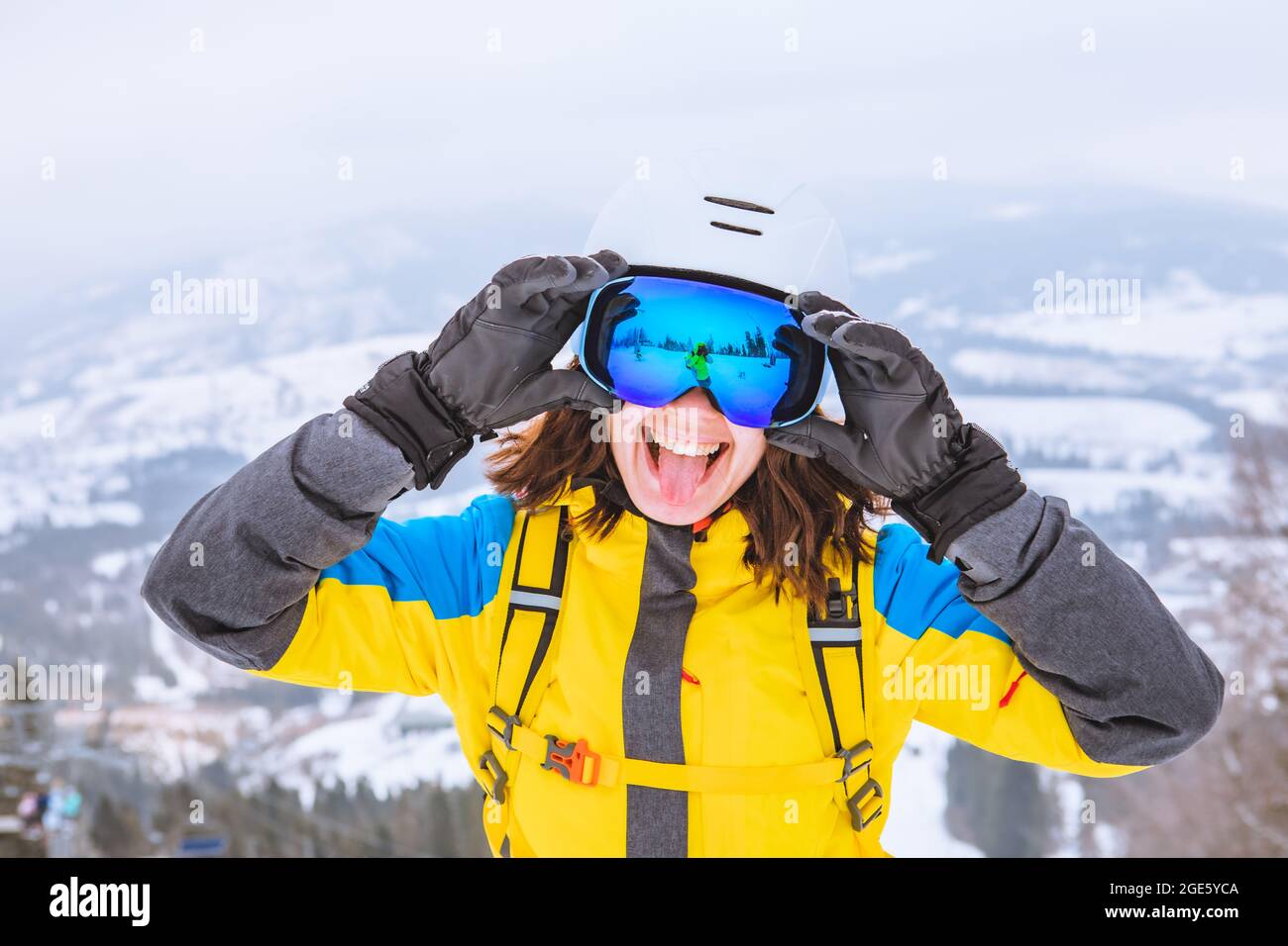 young pretty smiling woman in ski 