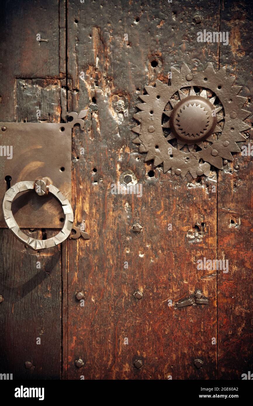 Old Studded Wooden Door with Metal Handle and Star Stock Photo