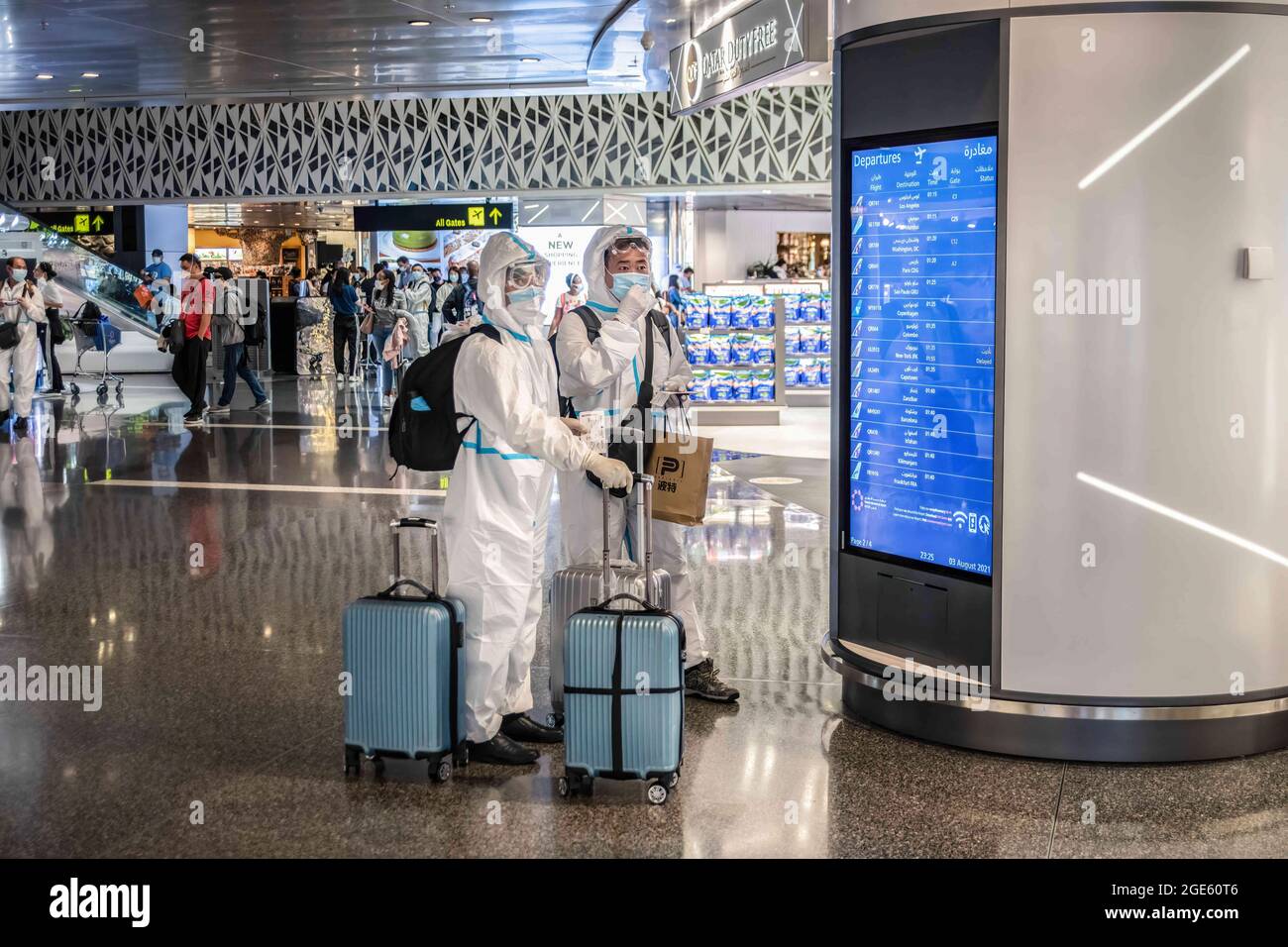 Doha, Qatar. 4th Aug, 2021. Passengers wearing face shields, masks and