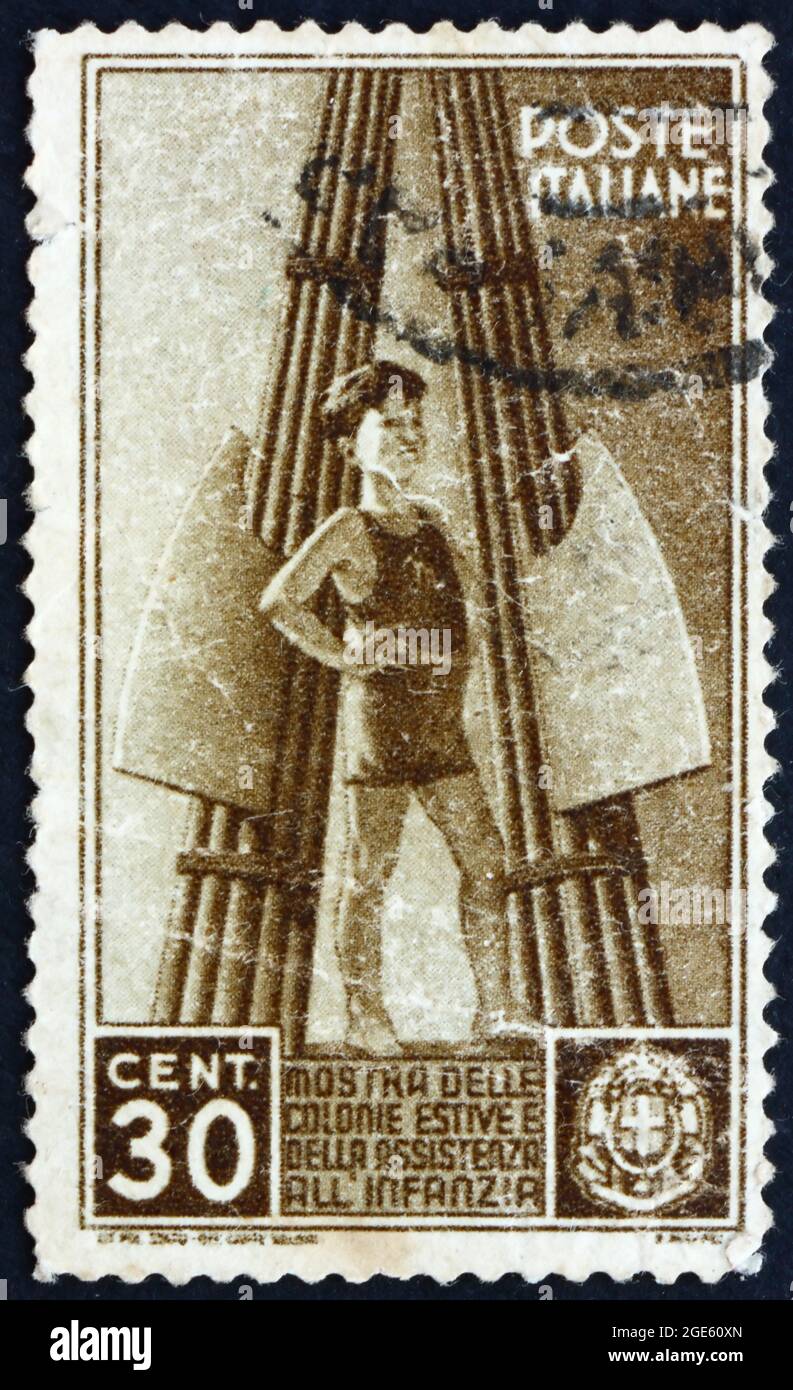 ITALY - CIRCA 1937: a stamp printed in the Italy shows Child and Fasces,  circa 1937 Stock Photo - Alamy