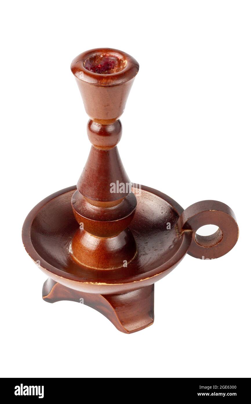 Wooden candlestick on a white background. Oldfashioned brown