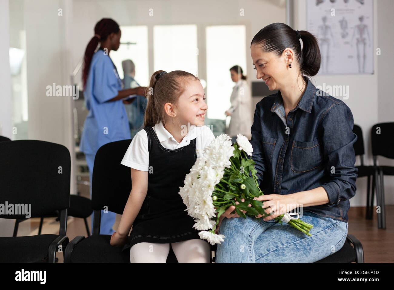 Family bringing flowers during clinical consultation waiting in