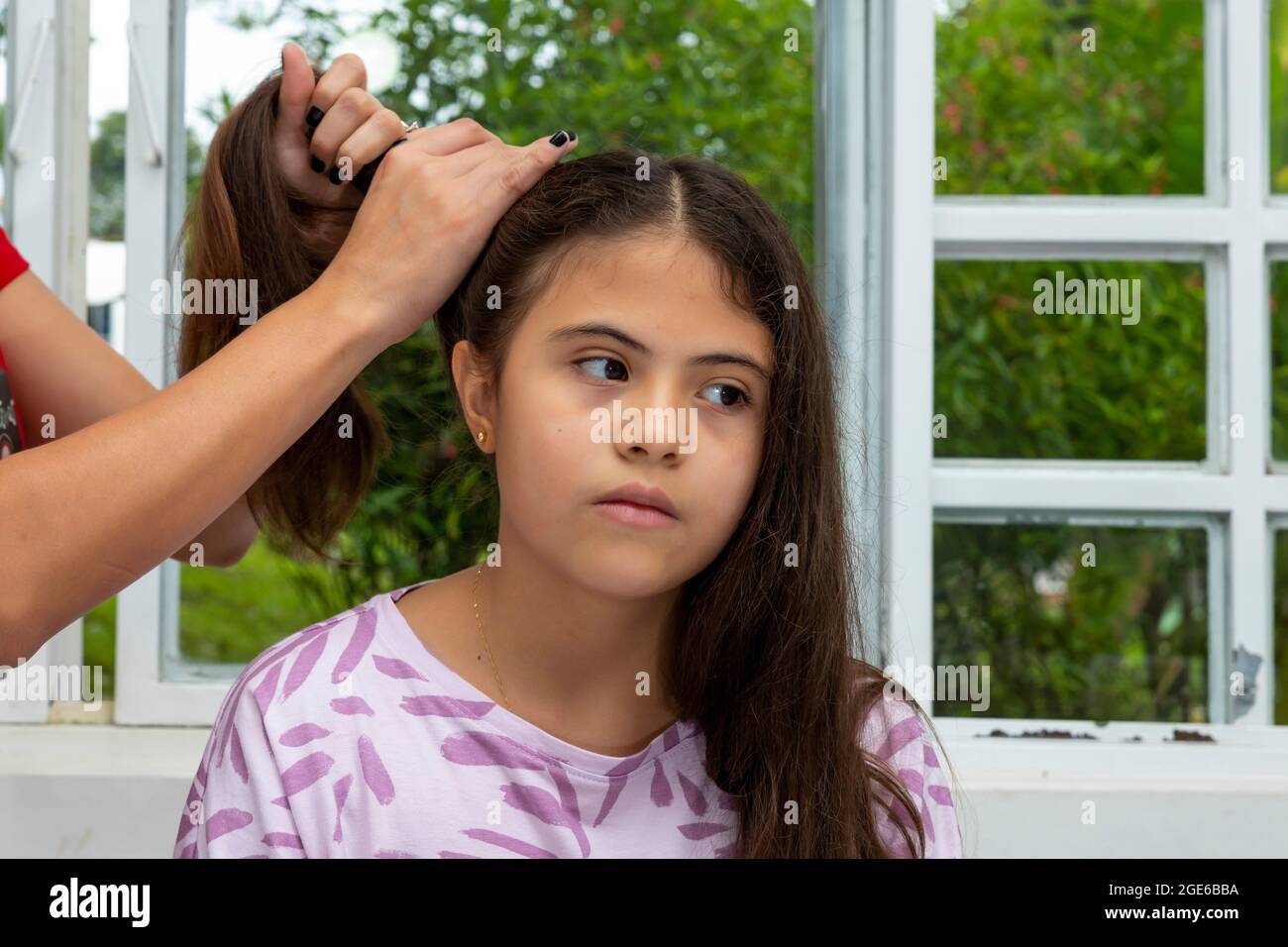 Girl brushing her long hair hires stock photography and images Alamy