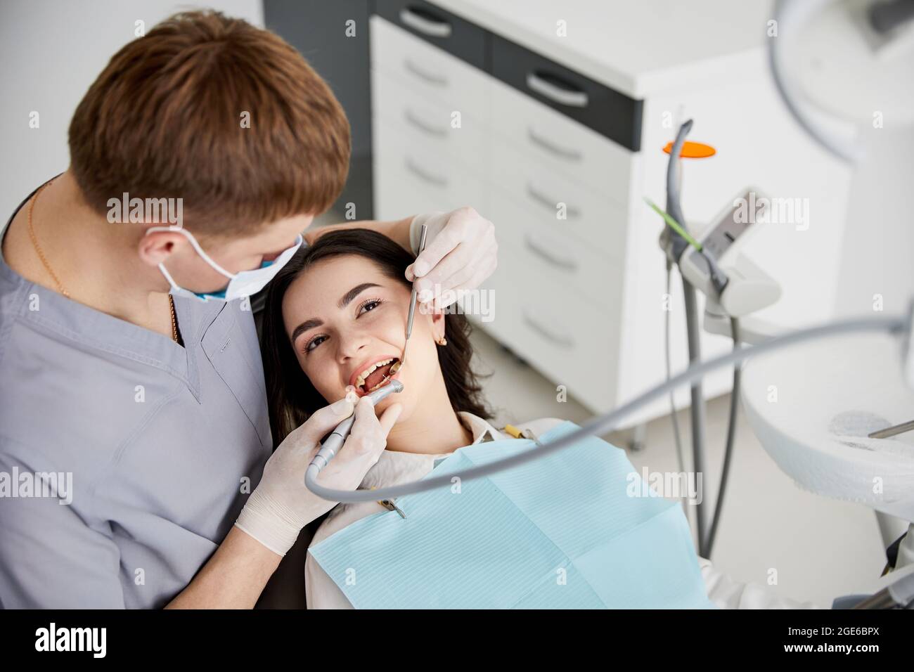 Portrait of smiling girl on a dental chair in dentistry Stock Photo