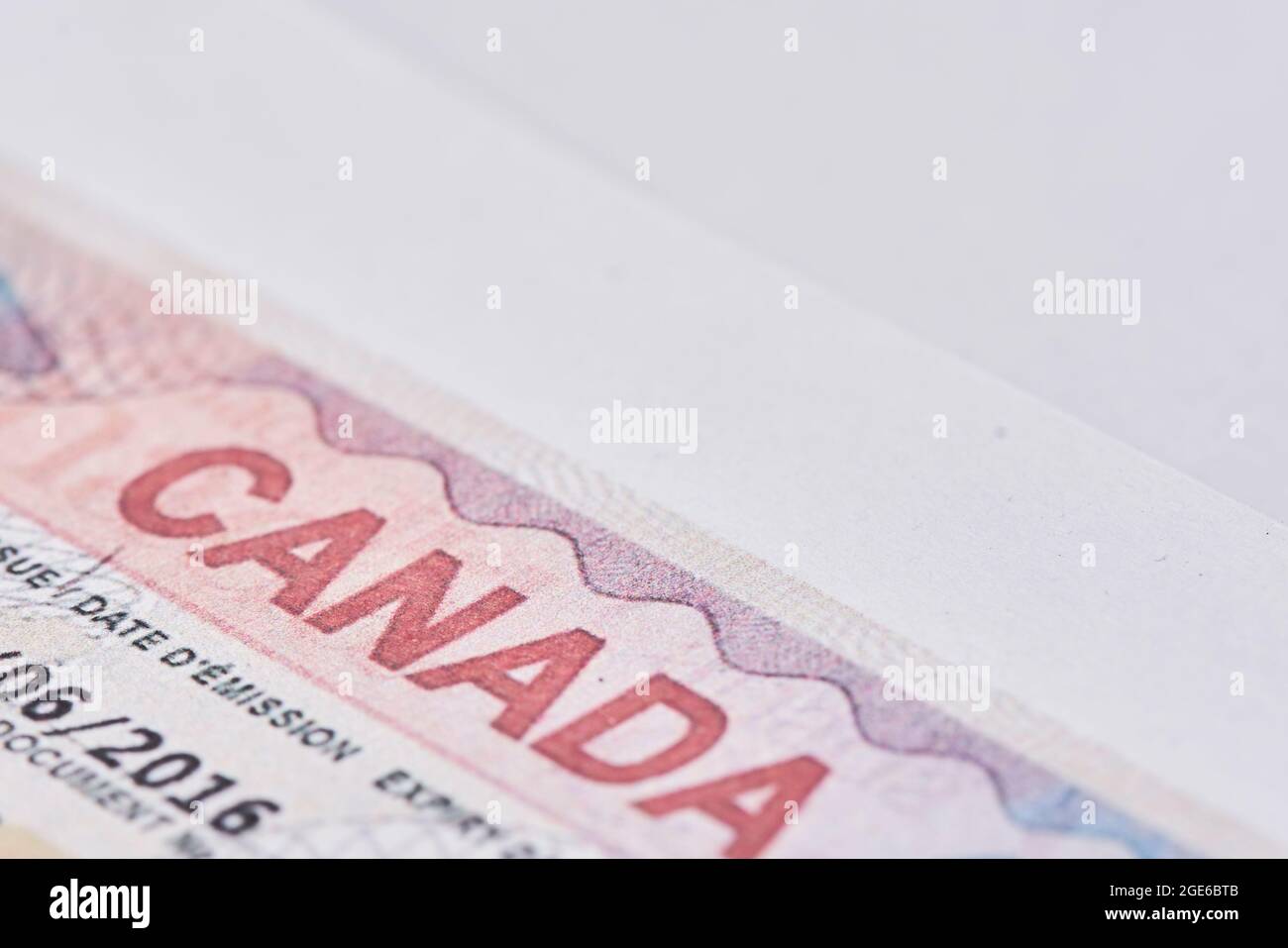 Tashkent, Uzbekistan - 13 August, 2021: Macro shot of Canadian visa. Close-up Canada resident immigration visa in passport Stock Photo
