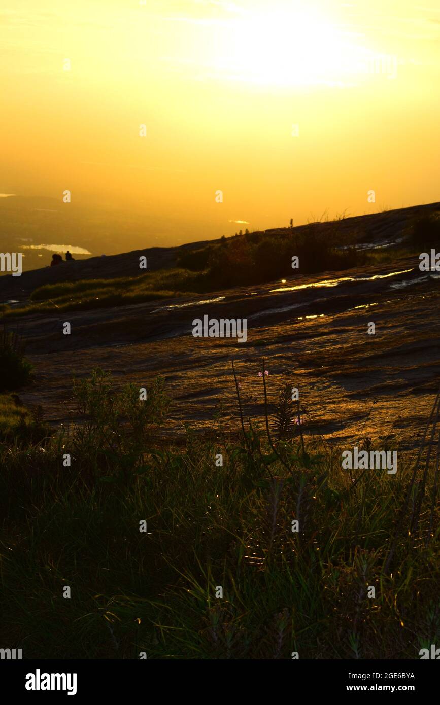 Land slides and orange sky Stock Photo