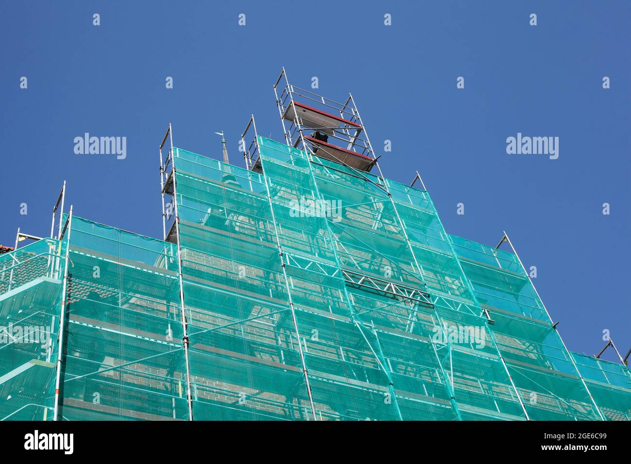 tarpaulin, construction site, scaffolding, house facade, roof gable, old building, Lübeck, Germany, Europe Stock Photo