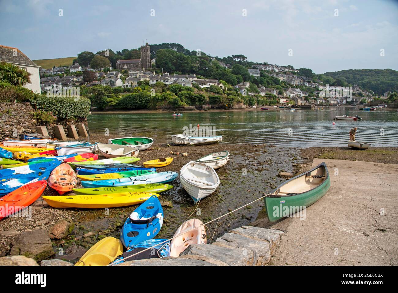 Small colourful boats at low tide on the River Yealm at Newton Ferrers looking towards Noss Mayo, South Devon, England, UK Stock Photo