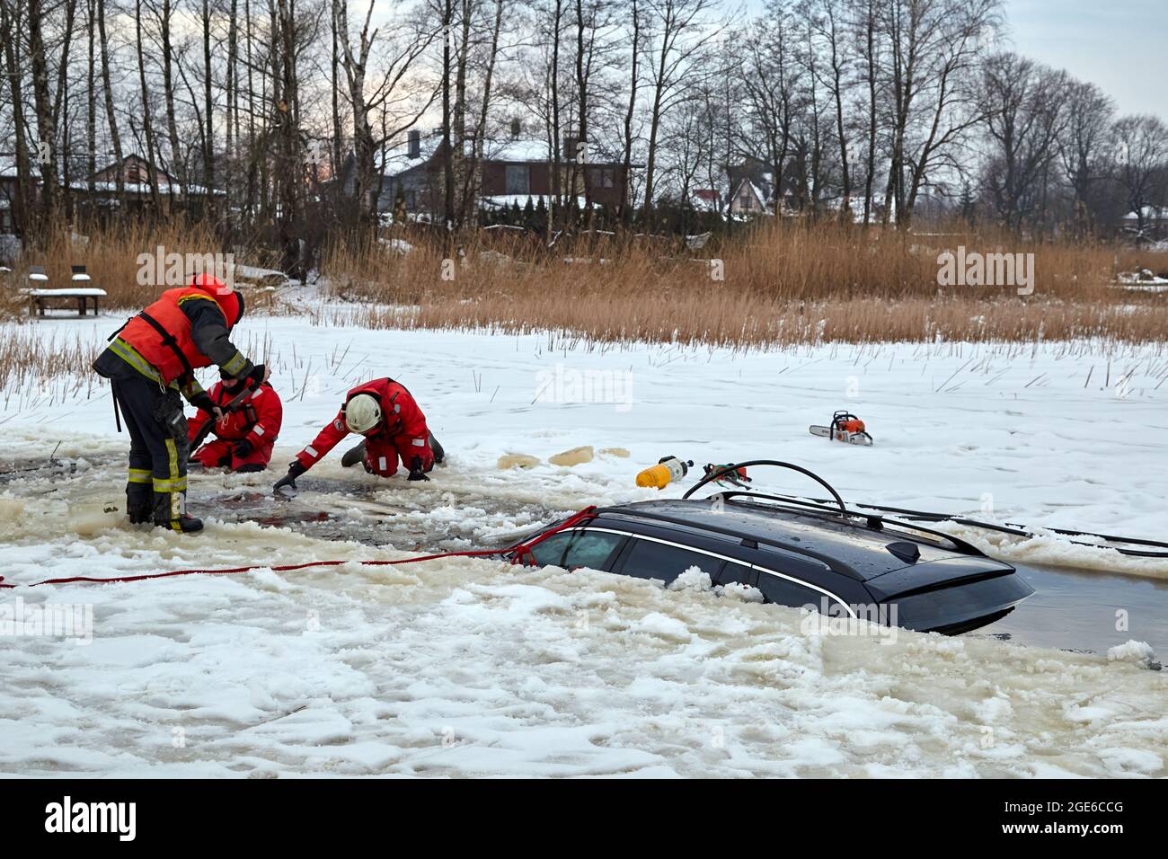 The car broke into the ice and drowned in the lake. Work of the rescue service Stock Photo