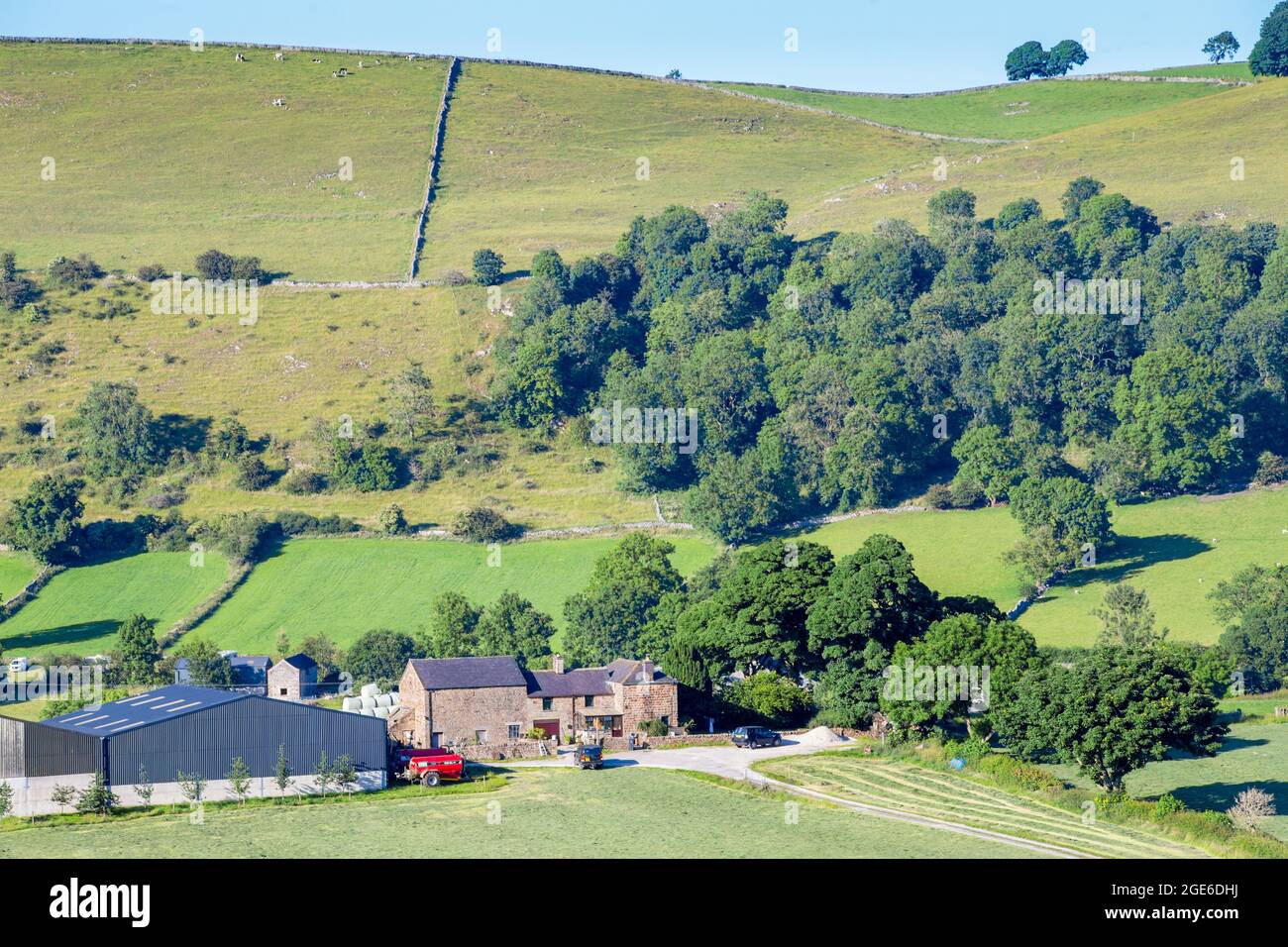 Farm buildings in a valley in the Peak District National Park Stock Photo