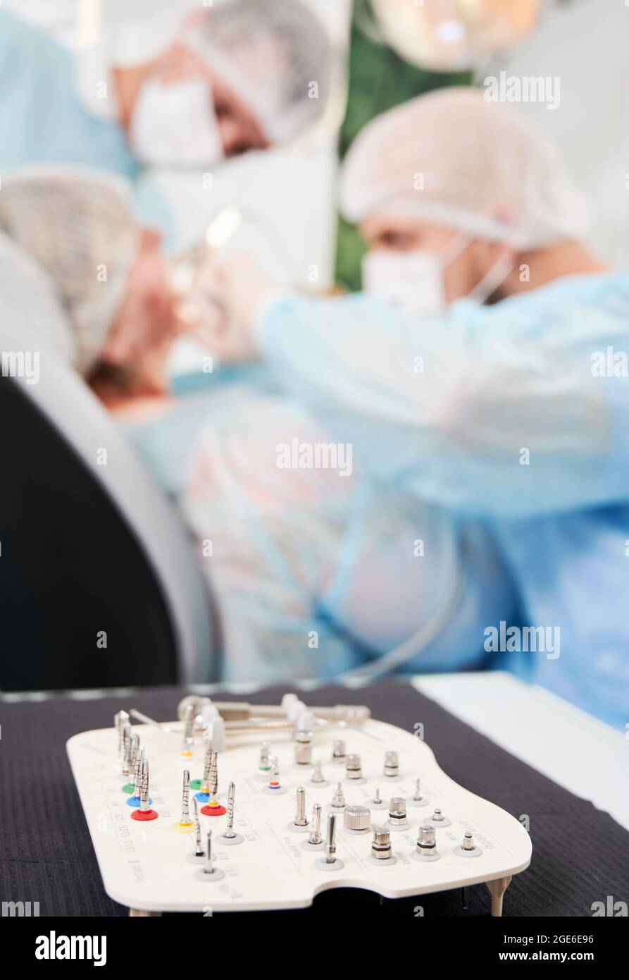 Close-up vertical snapshot of set of metal heads for dental bur machine ...
