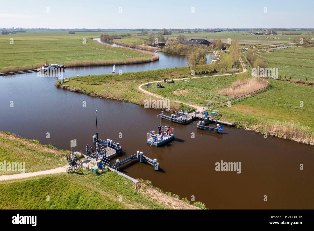 The Netherlands, Woerdense-Verlaat. Foot ferry crossing Drecht river. Human powered. Aerial. Stock Photo