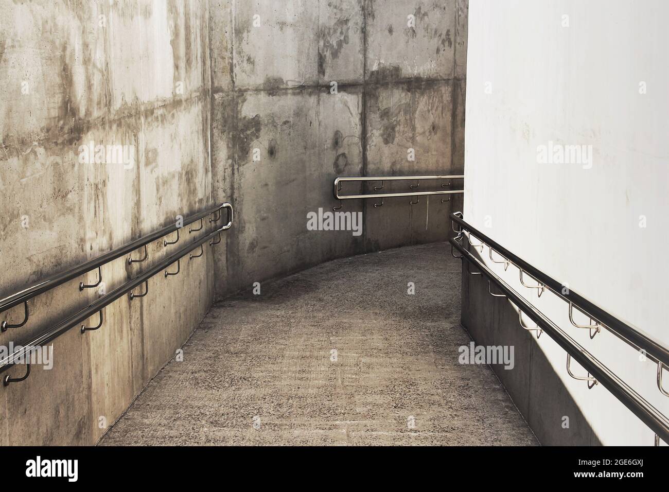 Concrete corridor with railing Stock Photo - Alamy