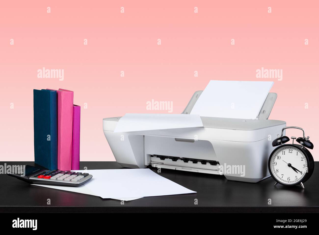 Compact home laser printer against pink background Stock Photo
