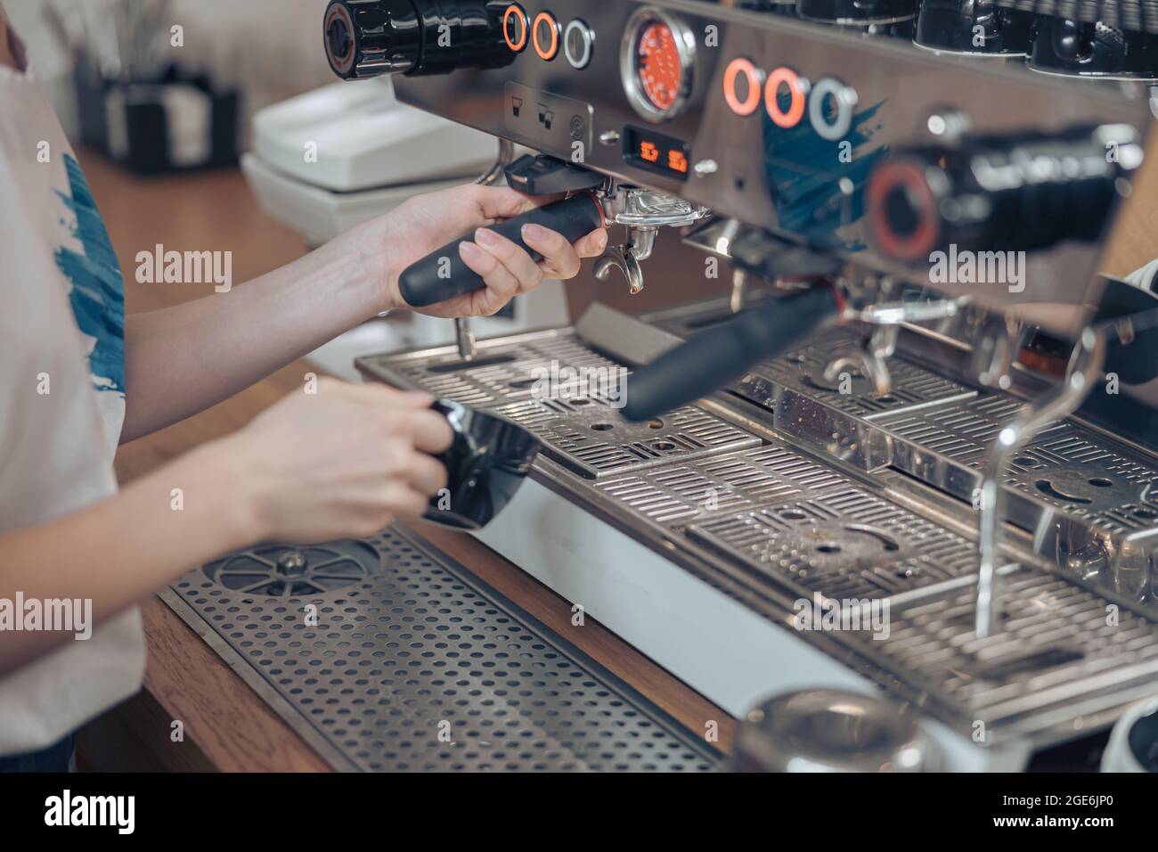 Female barista using coffee machine at work Stock Photo Alamy