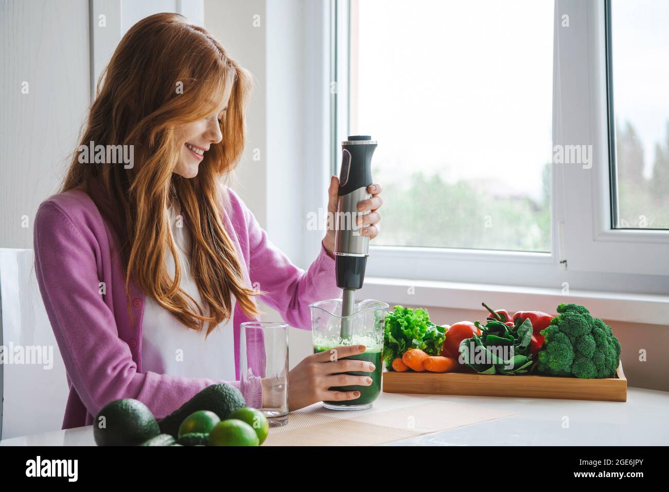 Ginger woman squeeze juice for healthy dieting and lifestyle. Fruit