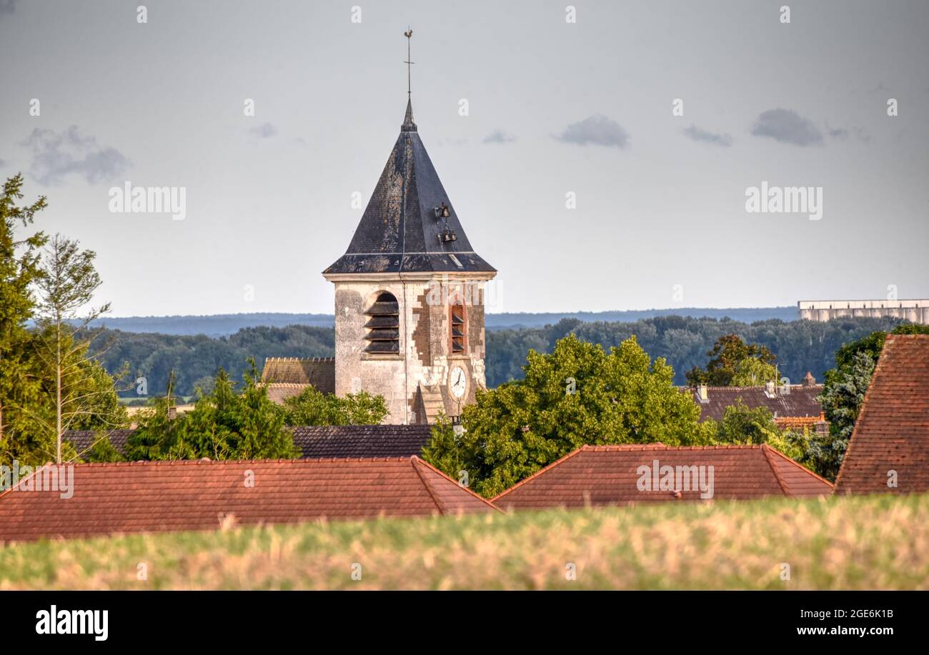The church stands out clearly at the end of a bright August day in France Stock Photo