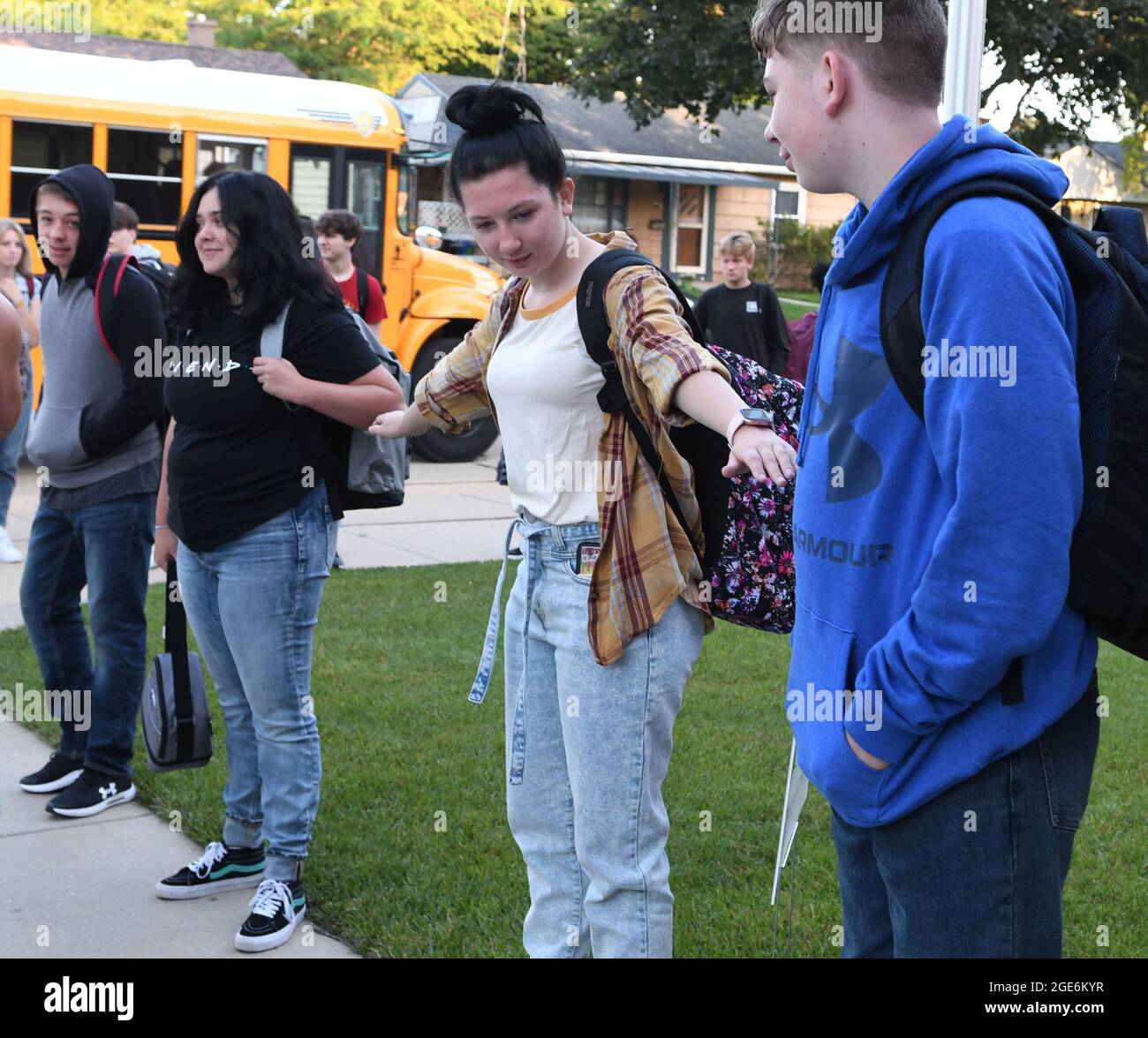 Racine, Wisconsin, USA. 17th Aug, 2021. ALLISON KNUE spreads her arms when students are asked to be six feet apart when they arrive for the first day of school at Racine Lutheran High School in Racine, Wisconsin Tuesday August 17, 2021. Students are required to be masked on school buses, but in-school masking decisions are left to studentsÃ¢â‚¬â„¢ parents. The school was party to a lawsuit last year contesting the city health departmentÃ¢â‚¬â„¢s decision to close schools. The Wisconsin Supreme Court ruled that the health department did not have the right to do so. (Credit Image: © Mark Hertzb Stock Photo