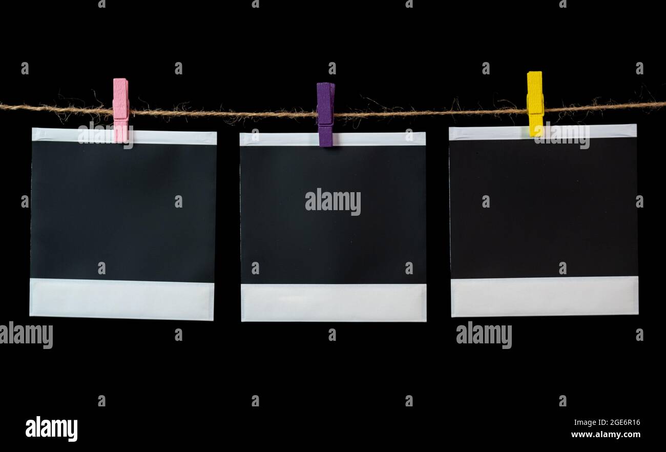 Blank square photo frames hanging on a clothesline. Blank square photo frames Stock Photo