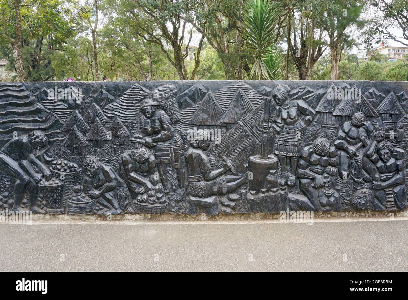 High relief black sculpture showing traditional life in Baguio
